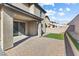 A patio in a backyard with brick pavers and a patch of artificial grass at 2740 Aldine Ct, Las Vegas, NV 89142