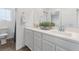 Bright bathroom with double vanity, white cabinets and tile floors at 2740 Aldine Ct, Las Vegas, NV 89142