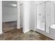 Modern bathroom showcasing a glass-enclosed shower, neutral tile, and bright lighting at 2740 Aldine Ct, Las Vegas, NV 89142