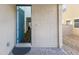 Inviting front entrance with a blue door, a stylish mat, and brick flooring at 2740 Aldine Ct, Las Vegas, NV 89142