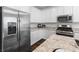 Close up of modern kitchen with stainless steel appliances, granite countertops and white cabinets at 2740 Aldine Ct, Las Vegas, NV 89142