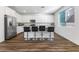 Bright kitchen with white cabinetry, stainless steel appliances, and breakfast bar seating at 2740 Aldine Ct, Las Vegas, NV 89142