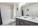 Well-lit bathroom with a shower-tub combo, modern vanity, and neutral decor for a clean look at 306 Dedication Ave, Henderson, NV 89011