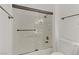 Glass-enclosed shower with a white bathtub at 3318 N Decatur Blvd # 2007, Las Vegas, NV 89130