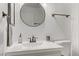 Bathroom featuring an above-counter sink with sleek hardware and a decorative mirror at 3318 N Decatur Blvd # 2007, Las Vegas, NV 89130