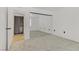 Bedroom featuring gray carpet, mirrored closets, and a ceiling fan at 3318 N Decatur Blvd # 2007, Las Vegas, NV 89130