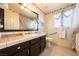 Bright bathroom with a decorative floral trim, neutral tile floor, and dark wood vanity at 341 Dylan Pl, Pahrump, NV 89048