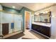 This well-maintained bathroom features a dual sink vanity, glass door shower, and neutral floor tiling at 341 Dylan Pl, Pahrump, NV 89048