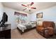 A bright bedroom featuring neutral colors, comfortable furniture, and a well-lit space for relaxation and rest at 341 Dylan Pl, Pahrump, NV 89048