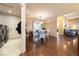 Bright dining area features hardwood floors, a modern chandelier, and an adjacent laundry area for added convenience at 341 Dylan Pl, Pahrump, NV 89048