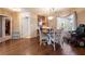 Hardwood dining room with natural light and seating for four at 341 Dylan Pl, Pahrump, NV 89048