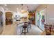 Well-lit kitchen with island, breakfast bar, and stainless steel appliances at 341 Dylan Pl, Pahrump, NV 89048