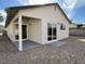 Cozy backyard featuring a covered patio and sliding glass doors for seamless indoor-outdoor living at 4240 Caliper Dr, Las Vegas, NV 89110