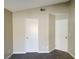 Bedroom with two white doors and light beige walls at 4240 Caliper Dr, Las Vegas, NV 89110