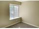 Bedroom with neutral walls, plush carpeting, and a window at 4240 Caliper Dr, Las Vegas, NV 89110