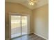 Cozy bedroom with sliding glass door access to outdoor space and ceiling fan at 4240 Caliper Dr, Las Vegas, NV 89110