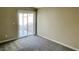 Bedroom with neutral walls and sliding glass door leading to outdoor space at 4240 Caliper Dr, Las Vegas, NV 89110