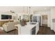 Bright, modern kitchen features a quartz island countertop, stainless steel appliances and pendant lighting at 4280 E Brusca Way, Pahrump, NV 89061