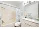 Well-lit bathroom boasts a shower-tub combo and stylish vanity with a large mirror at 4827 S Torrey Pines Dr # 204, Las Vegas, NV 89103