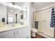 Bathroom featuring a shower stall and sink with a large framed mirror at 4827 S Torrey Pines Dr # 204, Las Vegas, NV 89103