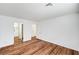 Bedroom showcasing beautiful wood-look floors, neutral walls, and an open doorway at 4827 S Torrey Pines Dr # 204, Las Vegas, NV 89103