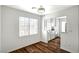 Dining area featuring wood floors, large window and view to the adjacent kitchen at 4827 S Torrey Pines Dr # 204, Las Vegas, NV 89103