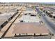 Overhead view of single-Gathering home showcasing desert landscaping and solar panels in a residential community at 5015 Terramont Dr, Las Vegas, NV 89135