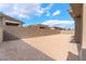 Large, undeveloped lot with partial privacy block wall surrounding the property at 5015 Terramont Dr, Las Vegas, NV 89135