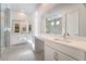 Spacious bathroom with double vanities, a makeup area, and a glass shower at 5015 Terramont Dr, Las Vegas, NV 89135