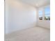 Bright bedroom features tile floors, neutral walls, and natural light from large windows at 5015 Terramont Dr, Las Vegas, NV 89135