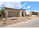 This single-story home boasts desert landscaping, a brick paver driveway, a two-car garage, and a stone entrance at 5015 Terramont Dr, Las Vegas, NV 89135