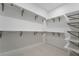 Organized walk-in closet with shelves and hanging racks at 5015 Terramont Dr, Las Vegas, NV 89135