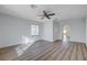 Bedroom with hardwood floors, ceiling fan, and ample natural light from the window at 519 Cayuga Ct, Boulder City, NV 89005