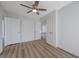 Bright bedroom with wood floors and multiple closet doors at 519 Cayuga Ct, Boulder City, NV 89005