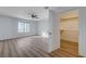 Bedroom featuring a ceiling fan, hardwood floors, a window, and walk-in closet at 519 Cayuga Ct, Boulder City, NV 89005