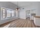 Bright dining area features large windows and a modern chandelier at 519 Cayuga Ct, Boulder City, NV 89005