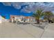 Expansive single-story home with a red tile roof, circular driveway, and stucco exterior at 519 Cayuga Ct, Boulder City, NV 89005