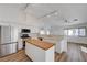 Bright kitchen with stainless steel appliances and a central wood-topped island at 519 Cayuga Ct, Boulder City, NV 89005