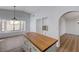 Kitchen island with wood top and white cabinets, perfect for food preparation and entertaining at 519 Cayuga Ct, Boulder City, NV 89005