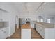 Bright kitchen featuring white cabinetry, wood-topped island, and stainless steel appliances at 519 Cayuga Ct, Boulder City, NV 89005