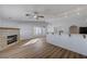 Open floorplan living room with fireplace and breakfast bar at 519 Cayuga Ct, Boulder City, NV 89005