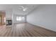 Open floorplan living room with fireplace, fan and vaulted ceiling at 519 Cayuga Ct, Boulder City, NV 89005