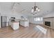 Bright open concept living room with kitchen and fireplace at 519 Cayuga Ct, Boulder City, NV 89005