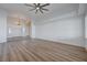 Open-concept living room with hardwood floors and a chandelier, leading to the front entrance at 519 Cayuga Ct, Boulder City, NV 89005