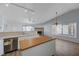 Open concept living room with a kitchen island and fireplace at 519 Cayuga Ct, Boulder City, NV 89005