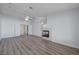 Spacious living room featuring new flooring, a ceiling fan, and an inviting atmosphere at 519 Cayuga Ct, Boulder City, NV 89005