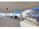 An outdoor patio area featuring white columns and decorative landscaping at 519 Cayuga Ct, Boulder City, NV 89005