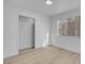 An empty bedroom with new floors features a large closet and bright window at 5264 Silverheart Ave, Las Vegas, NV 89142