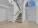 Bright foyer featuring tile floors, staircase, and modern accents that offer a welcoming entrance at 5264 Silverheart Ave, Las Vegas, NV 89142