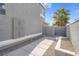 Narrow side yard with decorative rocks and concrete pavers at 5264 Silverheart Ave, Las Vegas, NV 89142